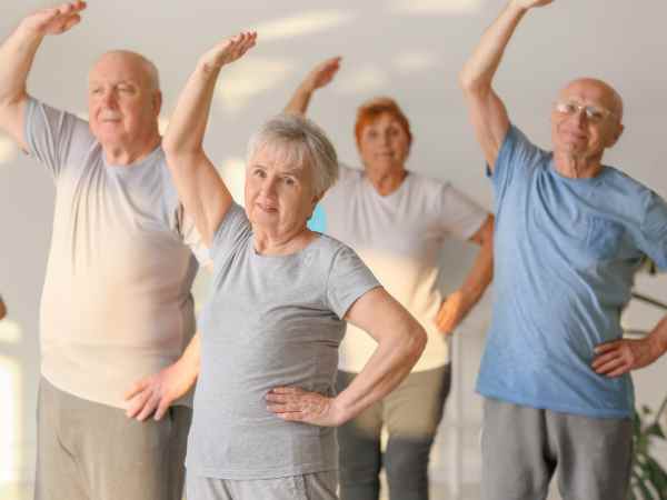 Seniors practicing gentle yoga to improve strength and balance at Relax Yoga, Chermside